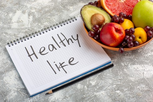 Woman tracking her weight loss progress and health metrics